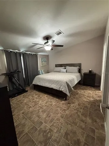 a bedroom with a bed and a walk in closet