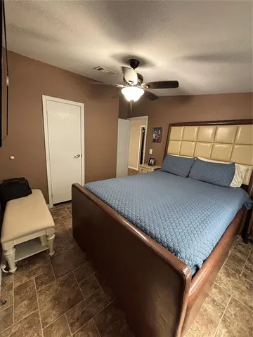 a bedroom with a bed and window