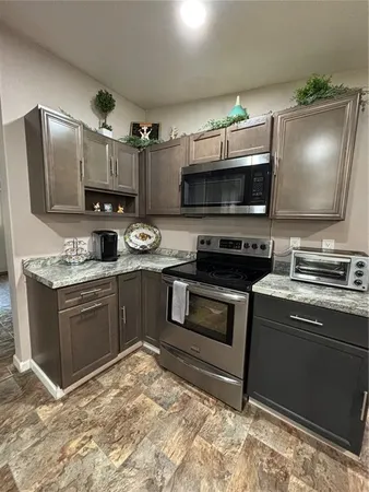 a kitchen with a stove and a microwave