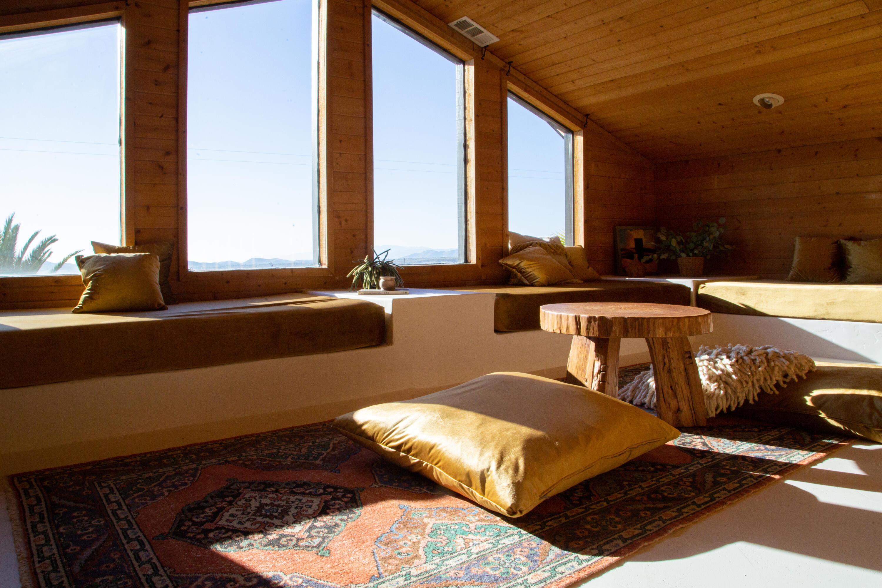 382 Cherokee Trail Yucca Valley, CA 92284 - Photo 15 of 66 a living room with couches rug and a large window