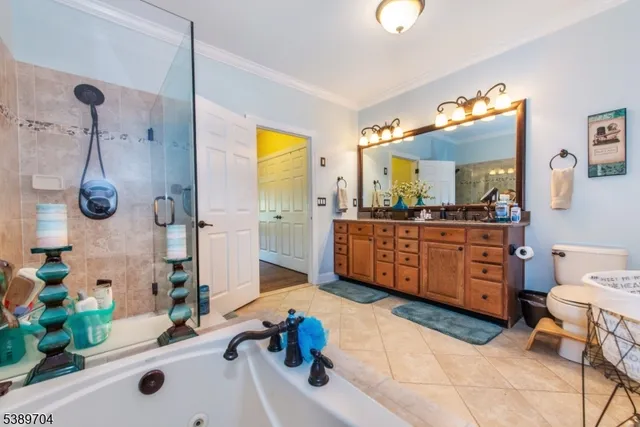 a bathroom with a tub sink and mirror