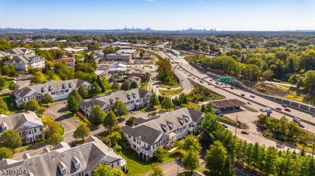 an aerial view of residential building with parking