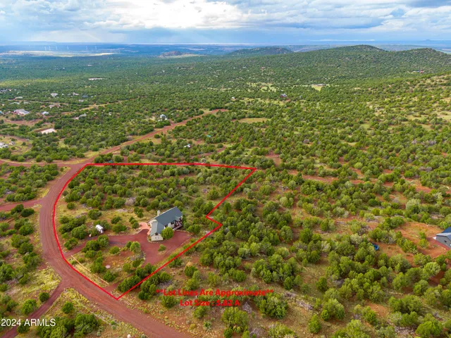 a view of a balcony with wooden fence and floor