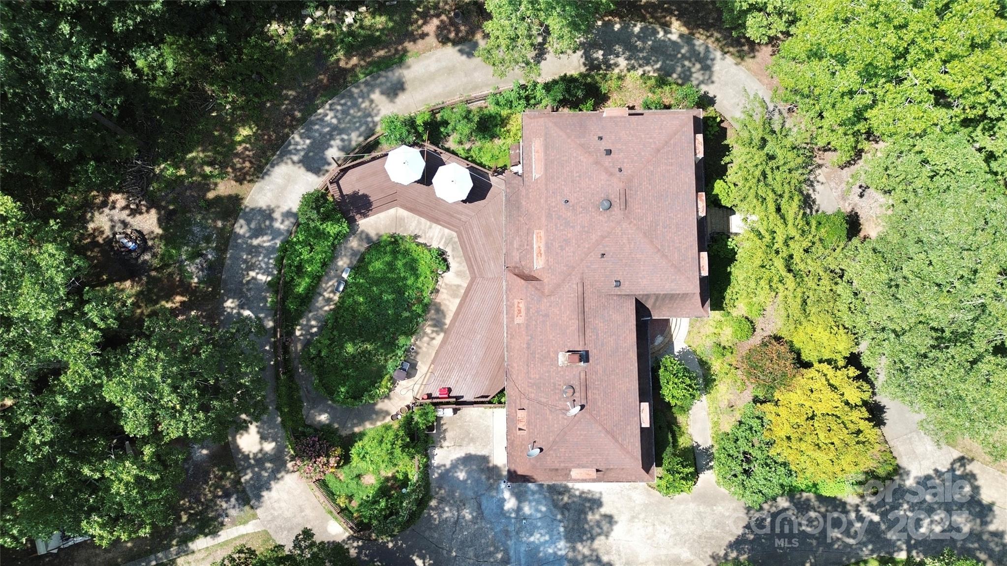 1940 Rock Hill Church Road Indian Trail, NC 28079 - Photo 2 of 46 an aerial view of a house with a yard and garden