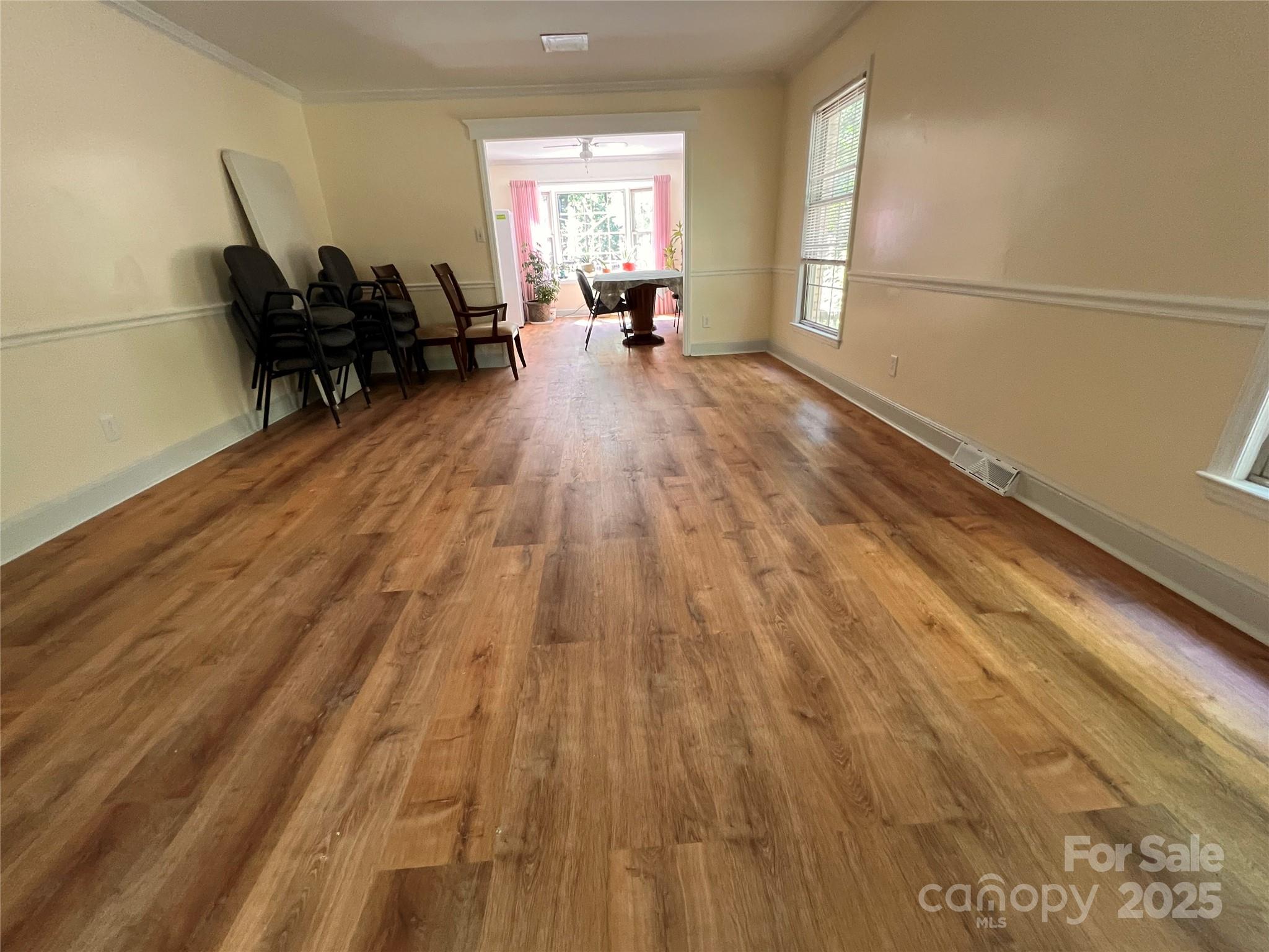 1940 Rock Hill Church Road Indian Trail, NC 28079 - Photo 30 of 46 a living room with furniture and a wooden floor
