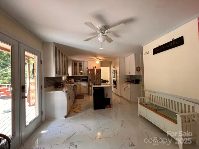 a kitchen with a refrigerator and a sink