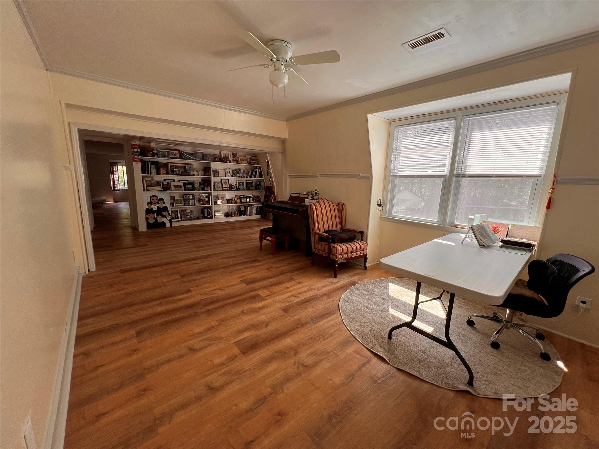 1940 Rock Hill Church Road Indian Trail, NC 28079 - Photo 37 of 46 a living room with furniture a flat screen tv and a window