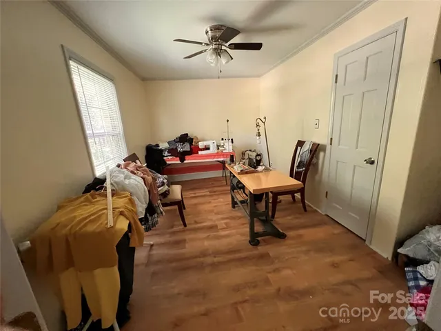 a living room with furniture a window and a chandelier