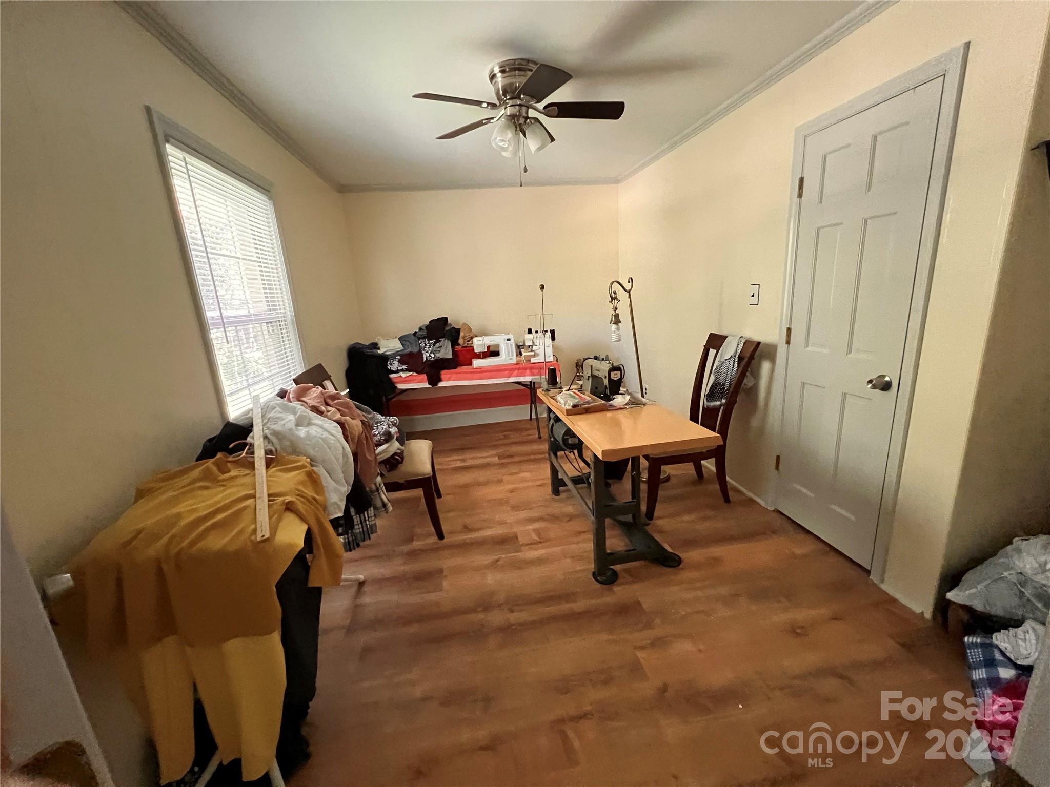 1940 Rock Hill Church Road Indian Trail, NC 28079 - Photo 43 of 46 a living room with furniture a window and a chandelier