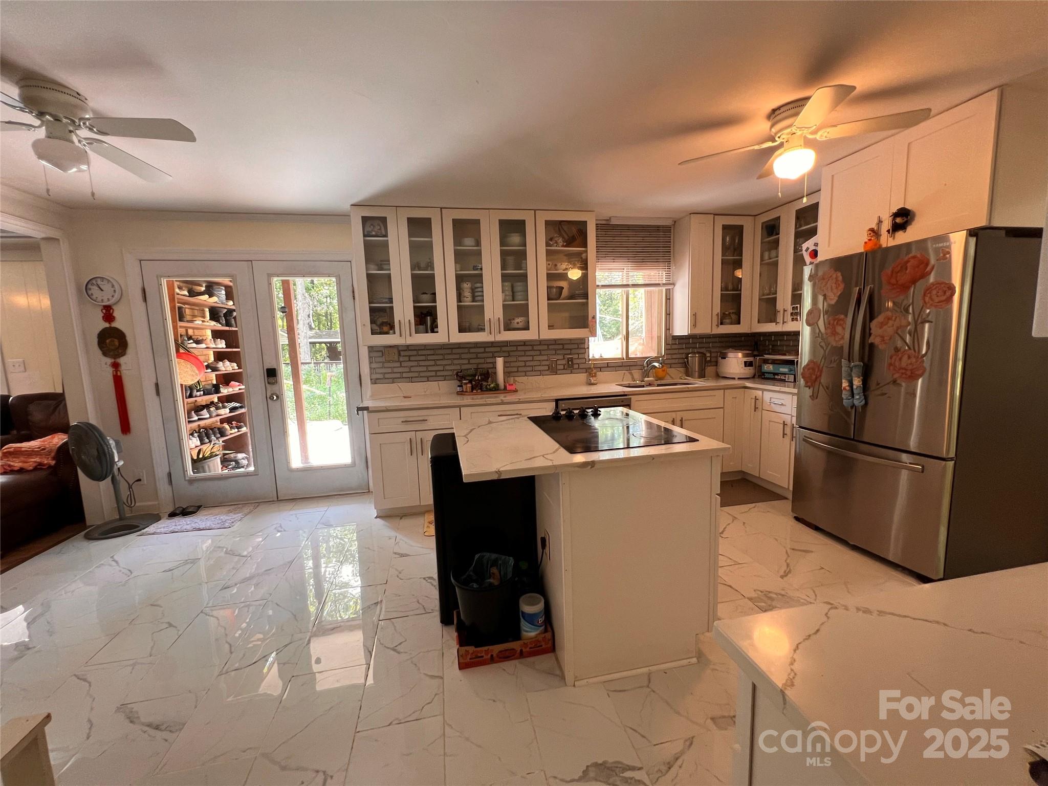 1940 Rock Hill Church Road Indian Trail, NC 28079 - Photo 45 of 46 a kitchen with a refrigerator and a stove top oven