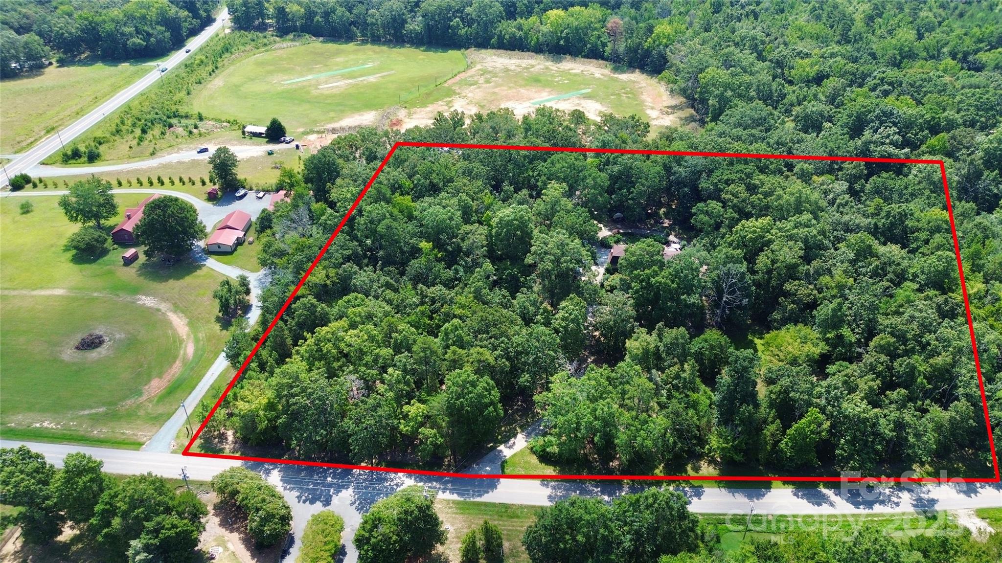 1940 Rock Hill Church Road Indian Trail, NC 28079 - Photo 5 of 46 a view of a flower in a yard with swimming pool