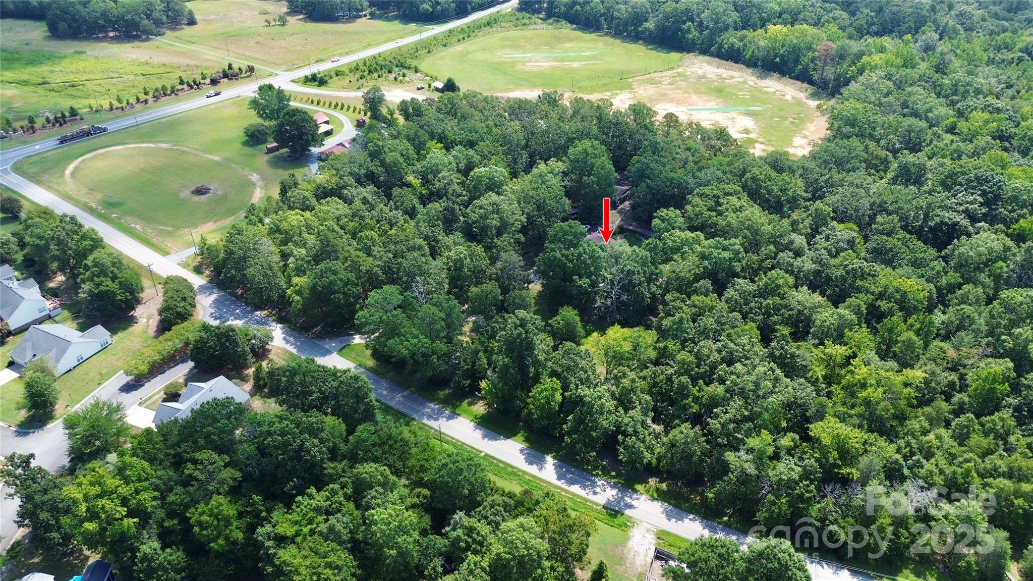 1940 Rock Hill Church Road Indian Trail, NC 28079 - Photo 6 of 46 an aerial view of residential house with outdoor space and swimming pool