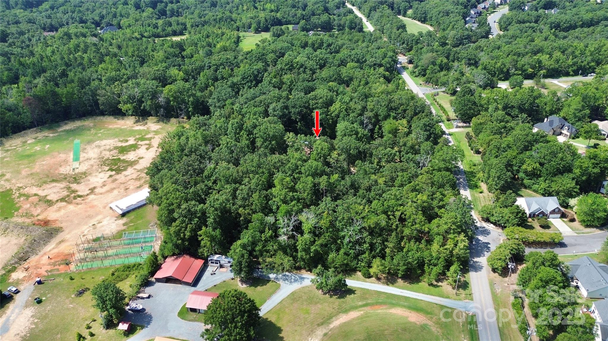 1940 Rock Hill Church Road Indian Trail, NC 28079 - Photo 8 of 46 a backyard of a house with a yard and fountain