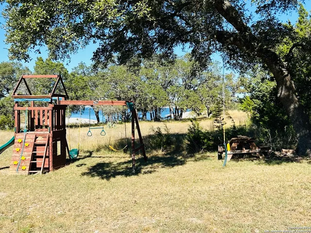 an outdoor space with lots of trees