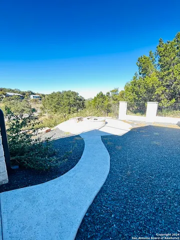 a view of a back yard of the house