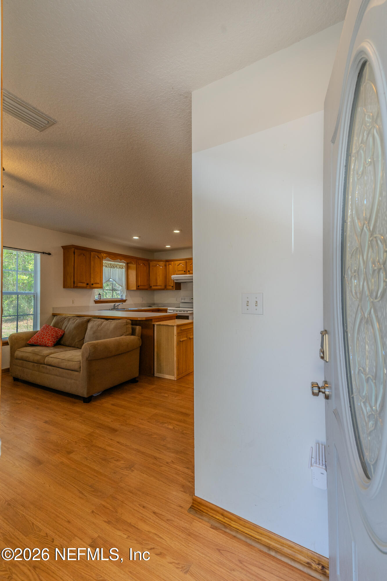1801 Lake Road Jacksonville, FL 32226 - Photo 22 of 72 a living room with furniture and a flat screen tv