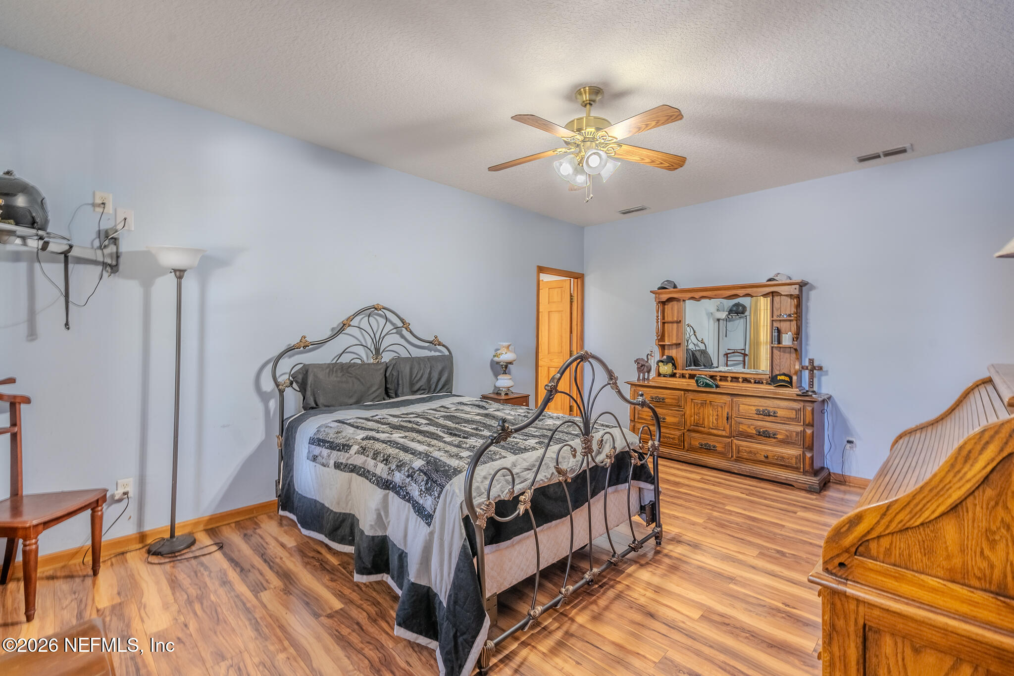 1801 Lake Road Jacksonville, FL 32226 - Photo 43 of 72 a bedroom with a bed and a chandelier