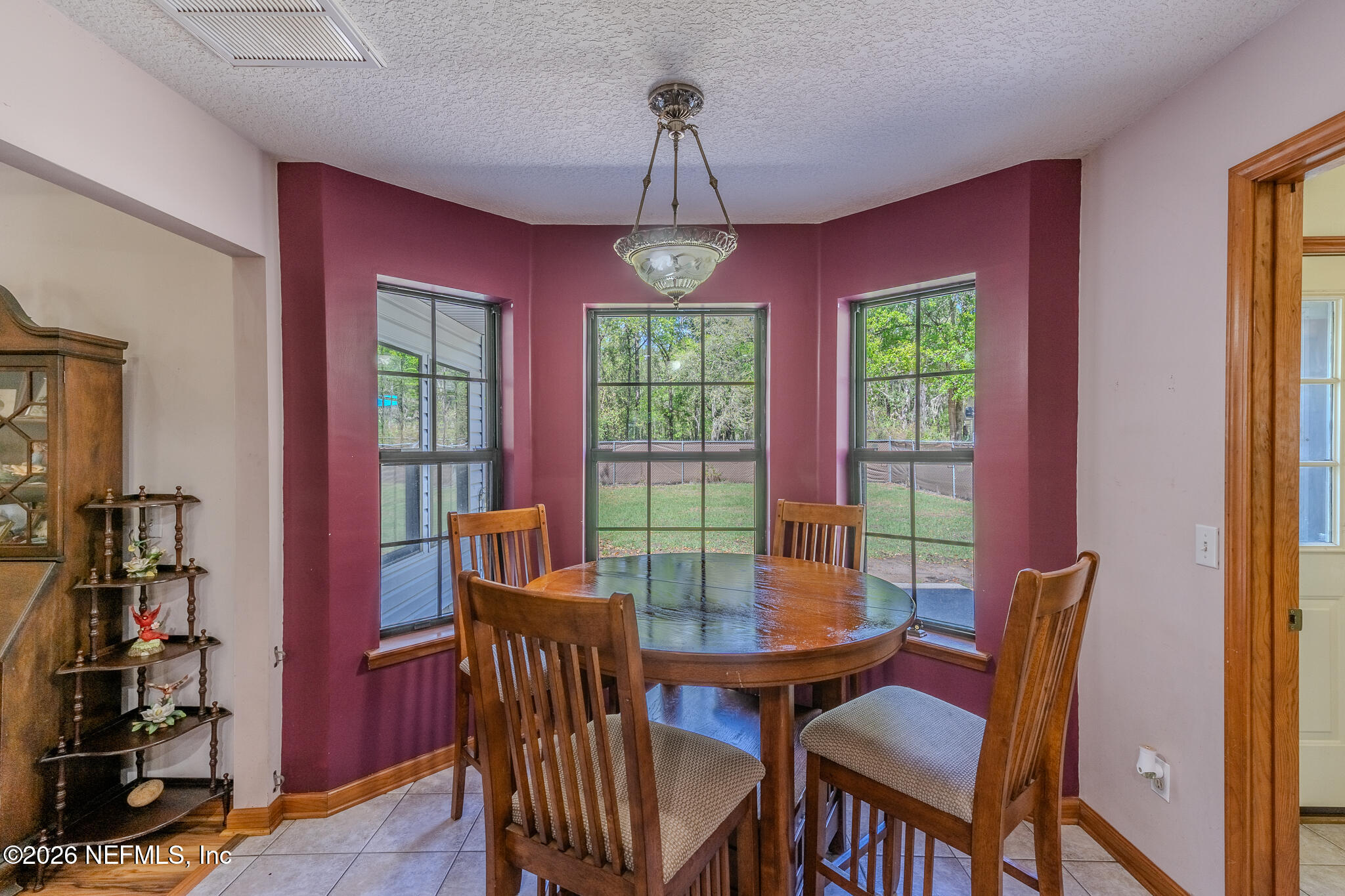 1801 Lake Road Jacksonville, FL 32226 - Photo 56 of 72 a view of a dining room with furniture window and wooden floor