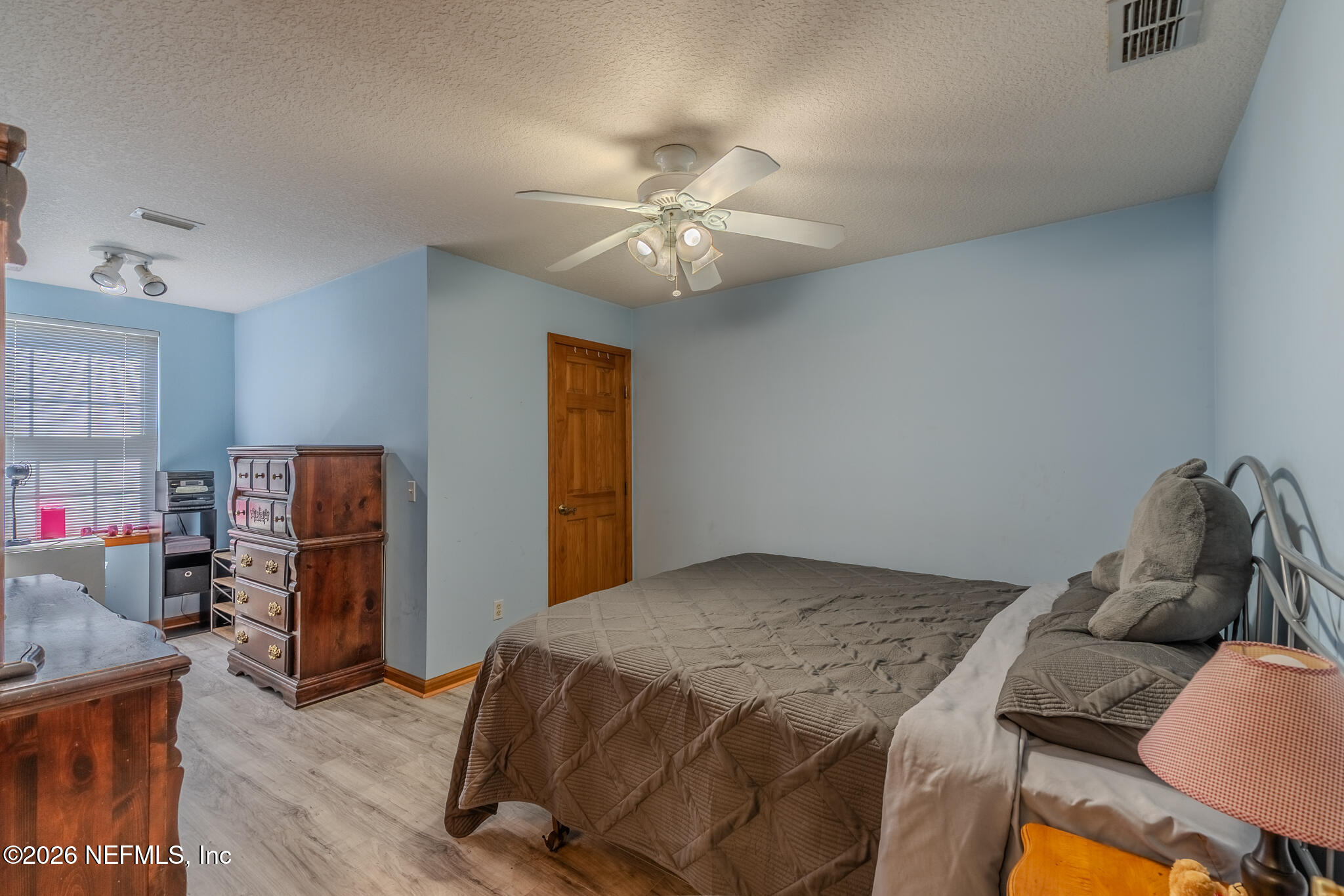 1801 Lake Road Jacksonville, FL 32226 - Photo 61 of 72 a bedroom with a bed and furniture