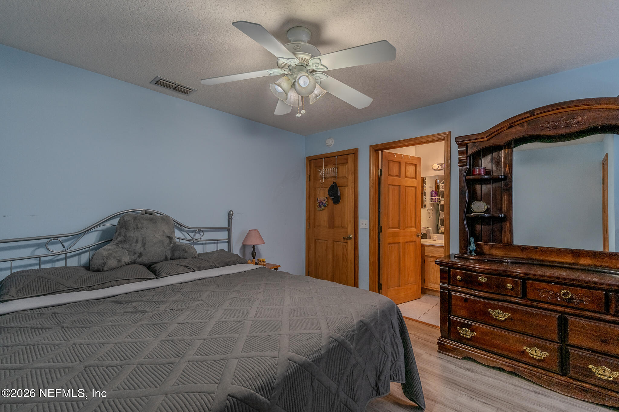 1801 Lake Road Jacksonville, FL 32226 - Photo 64 of 72 a bedroom with a bed and wooden floor
