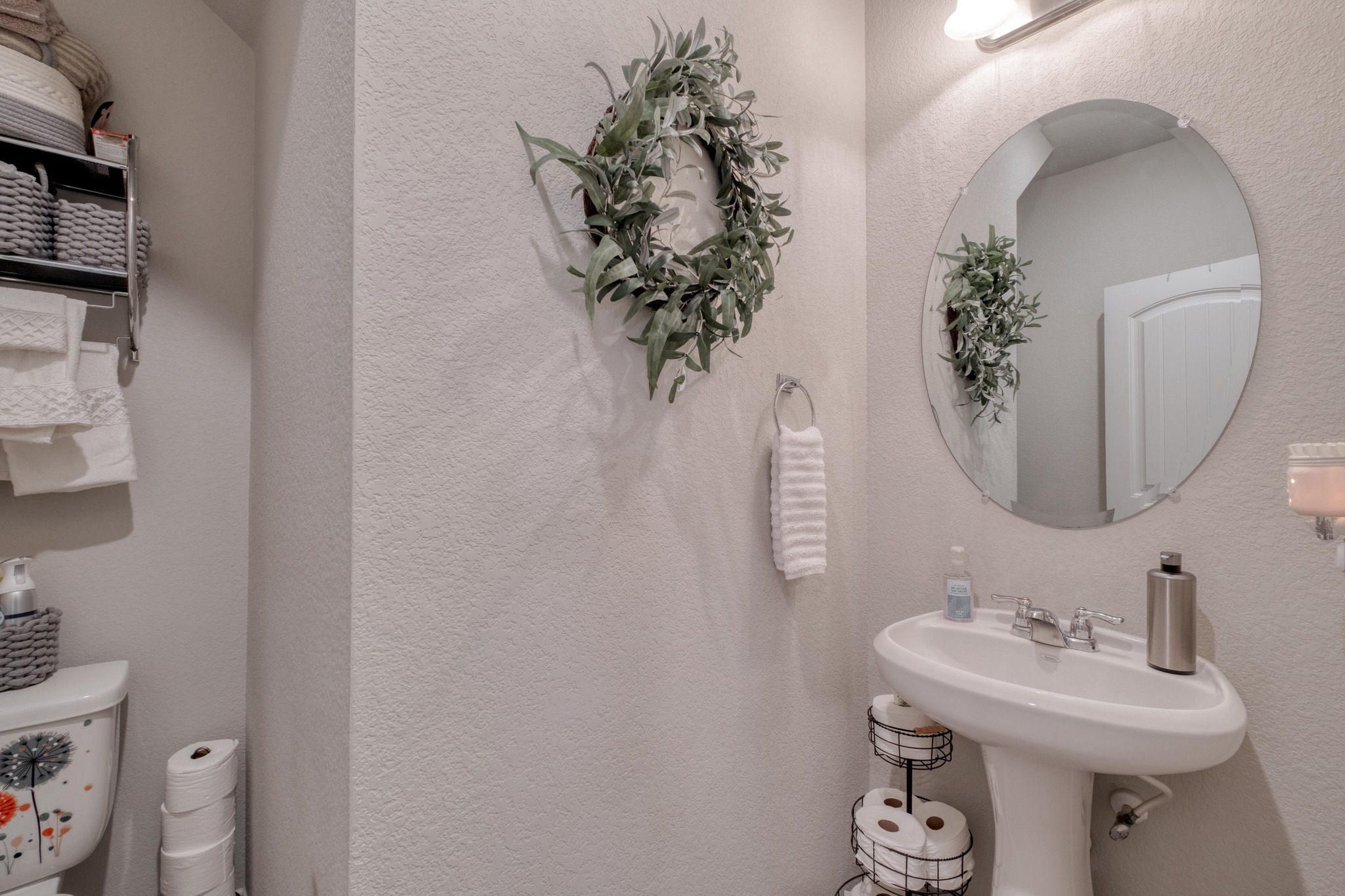 19028 Quebrada Drive Pflugerville, TX 78660 - Photo 16 of 36 a bathroom with a sink mirror and toilet