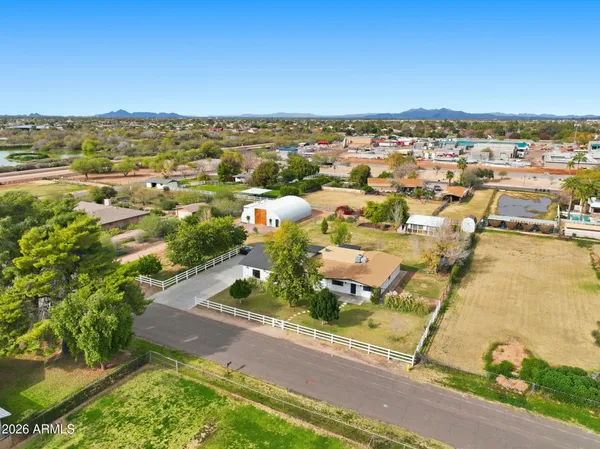 an aerial view of residential houses with outdoor space