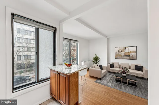 a living room with furniture and a window