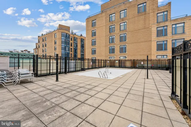 a view of a terrace with glass windows