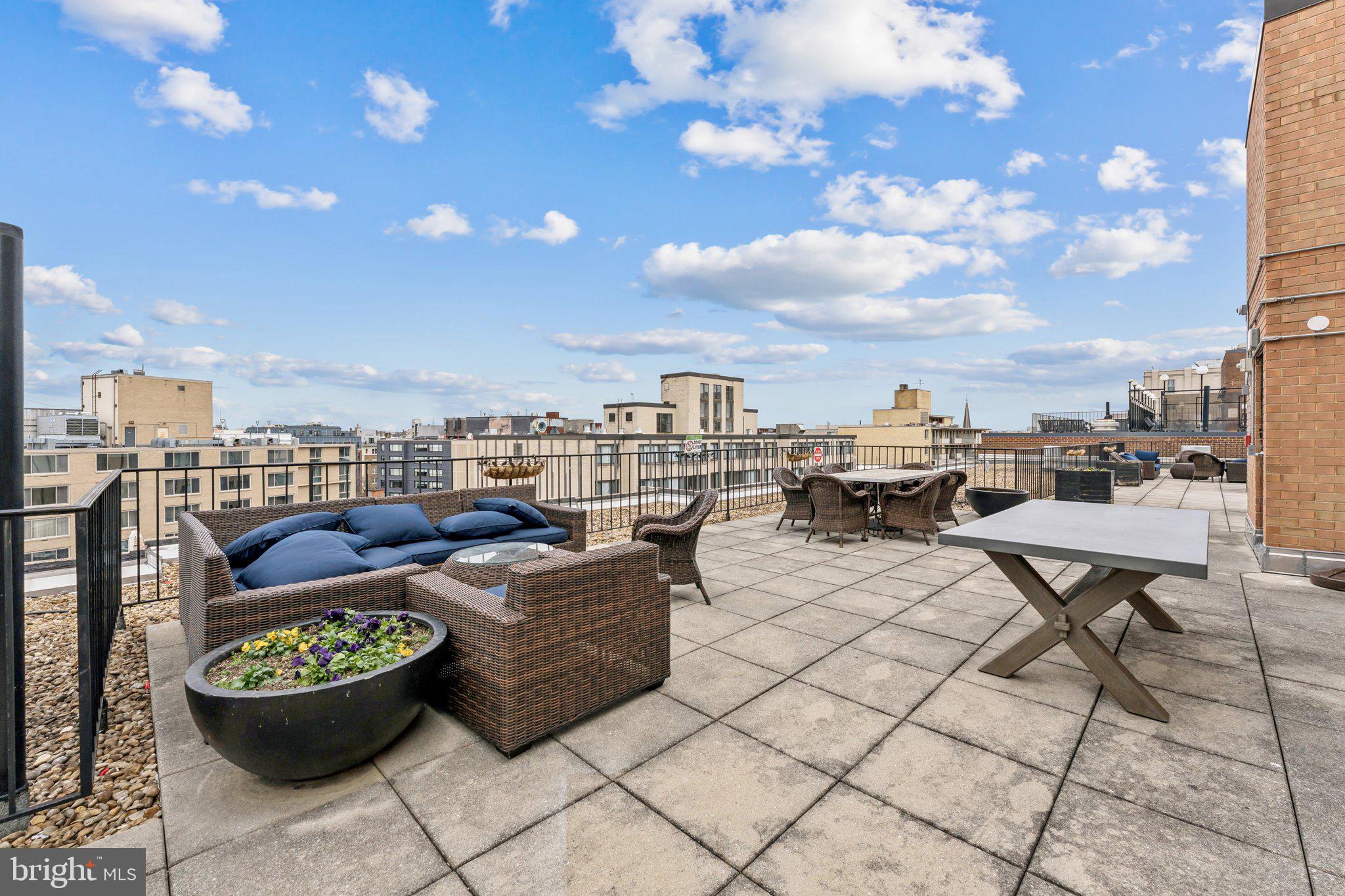 1440 N Street Northwest, Unit 312 Washington, DC 20005 - Photo 22 of 31 a living room with furniture and a table