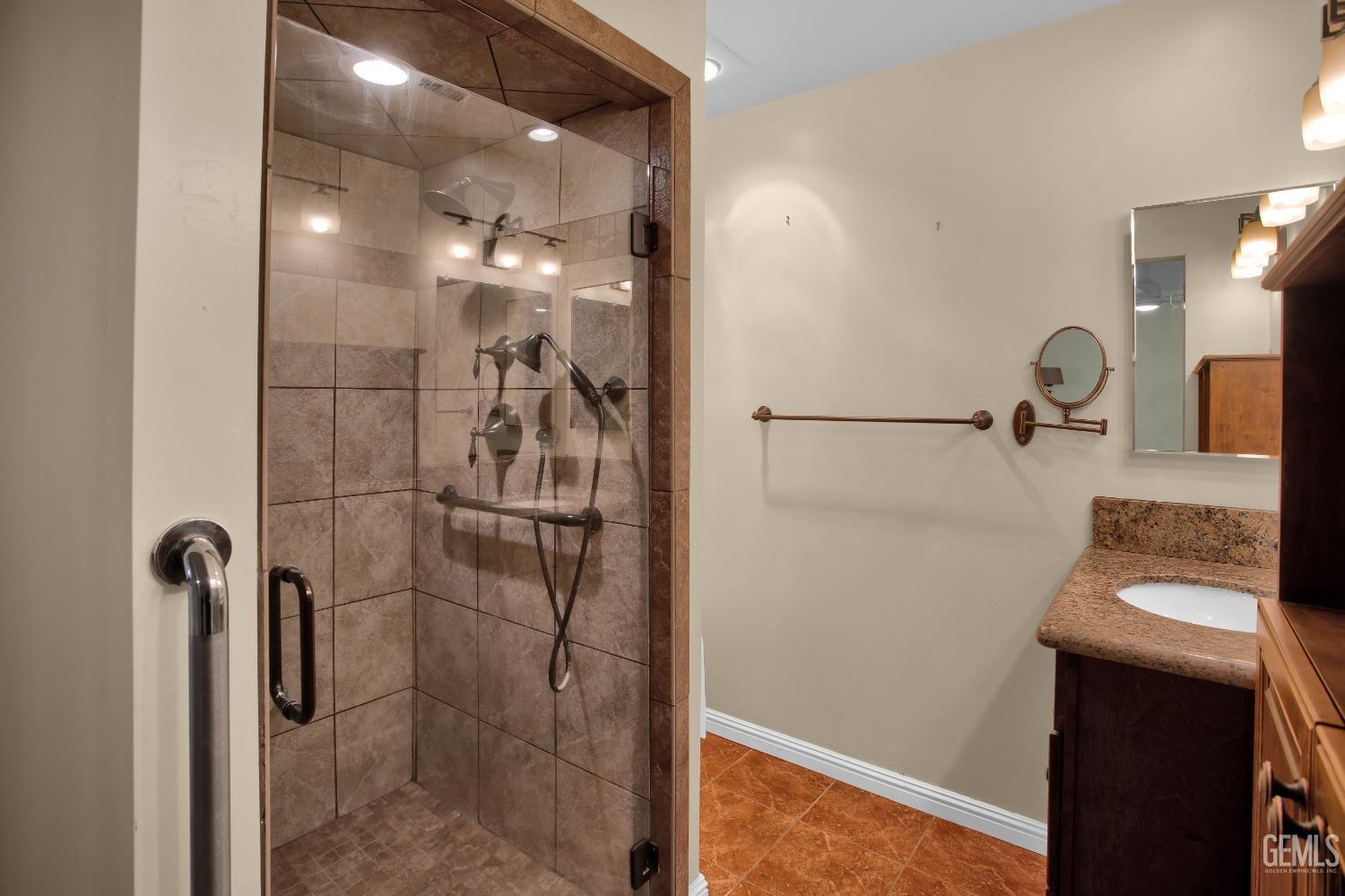 Undisclosed Address Bakersfield, CA 93312 - Photo 12 of 26 a bathroom with a shower