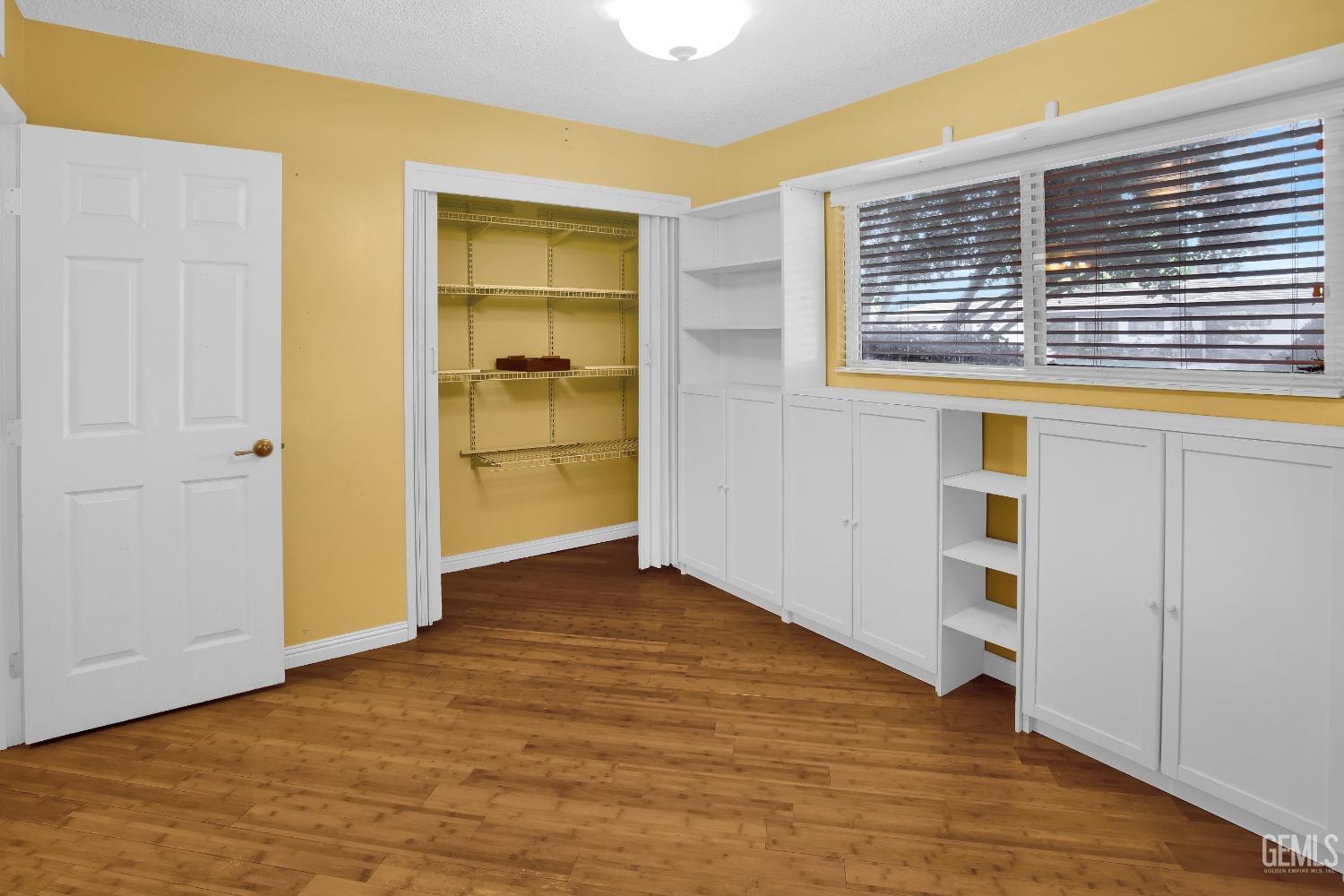 Undisclosed Address Bakersfield, CA 93312 - Photo 14 of 26 a view of an empty room with closet and a window