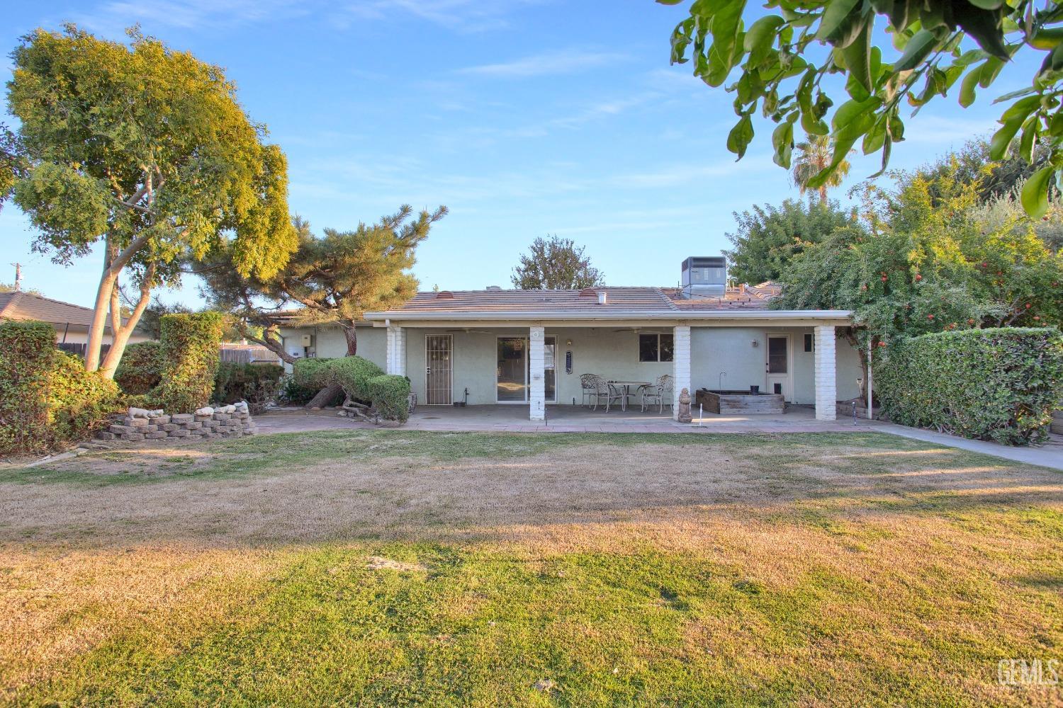 Undisclosed Address Bakersfield, CA 93312 - Photo 18 of 26 a front view of a house with a yard