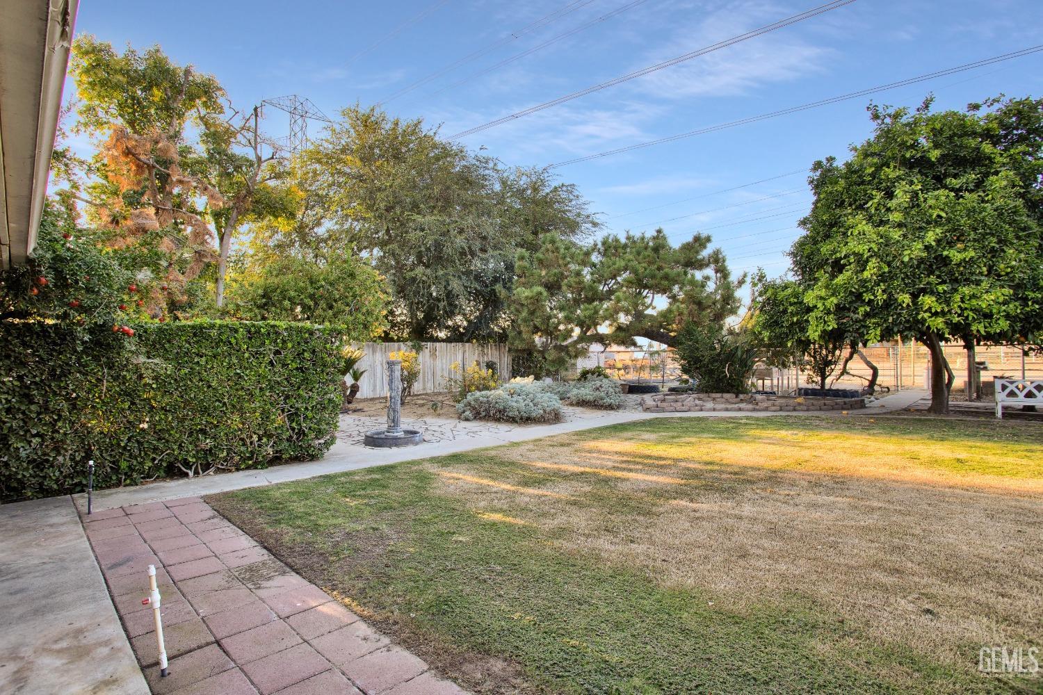 Undisclosed Address Bakersfield, CA 93312 - Photo 20 of 26 a view of swimming pool with an outdoor space and seating area