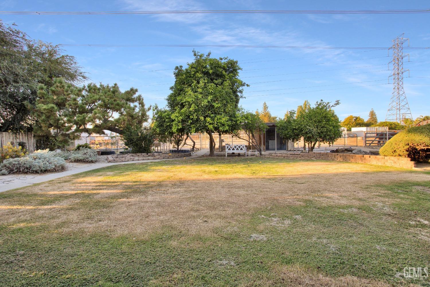 Undisclosed Address Bakersfield, CA 93312 - Photo 21 of 26 a view of swimming pool with an outdoor space and seating area