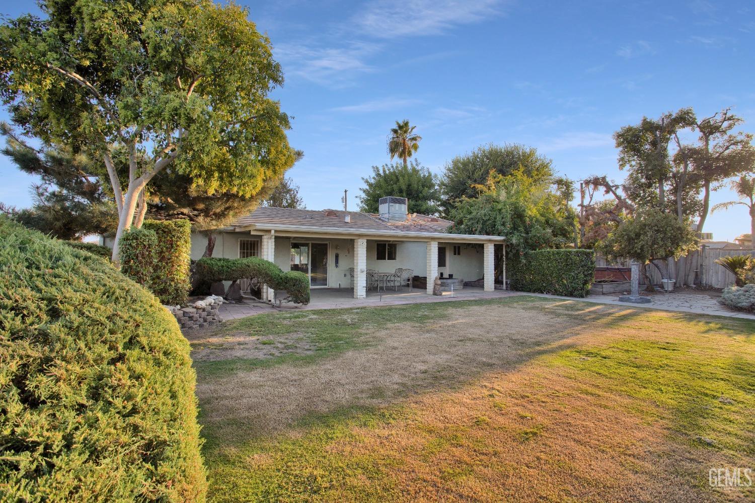 Undisclosed Address Bakersfield, CA 93312 - Photo 22 of 26 a view of a house with backyard and sitting area