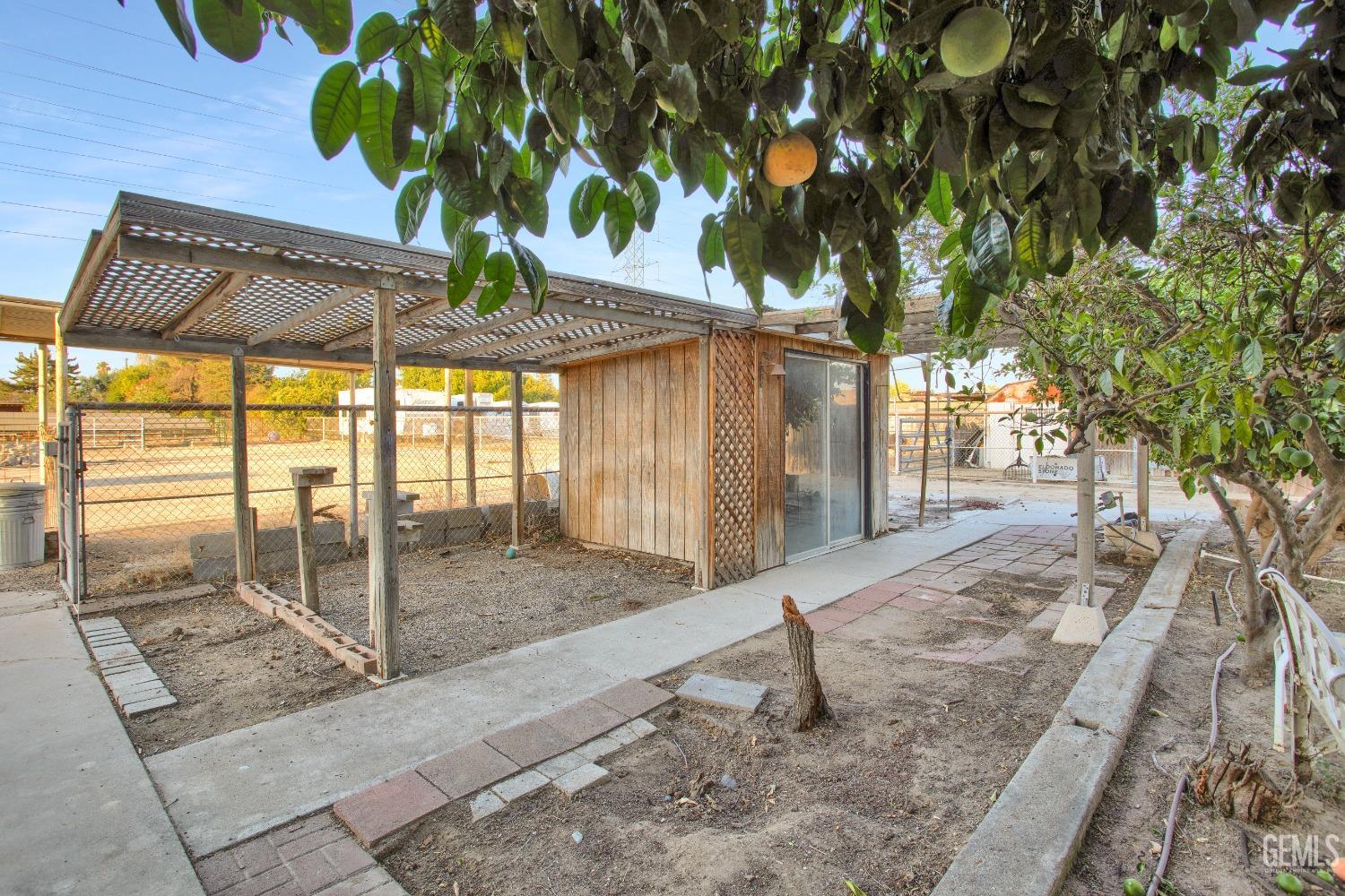 Undisclosed Address Bakersfield, CA 93312 - Photo 24 of 26 a glass door with a tree in the center