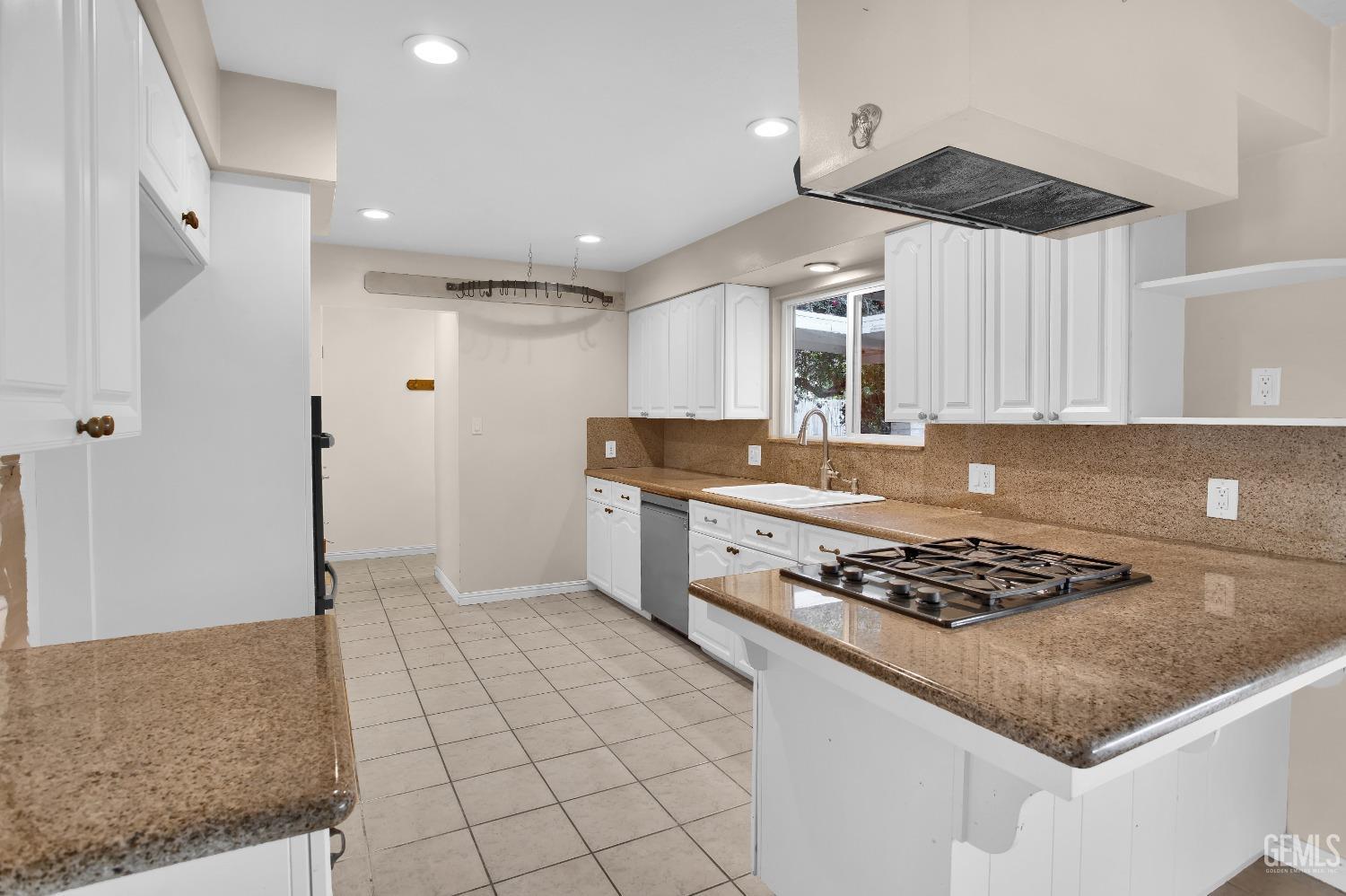 Undisclosed Address Bakersfield, CA 93312 - Photo 6 of 26 a kitchen with stainless steel appliances granite countertop a sink stove and refrigerator