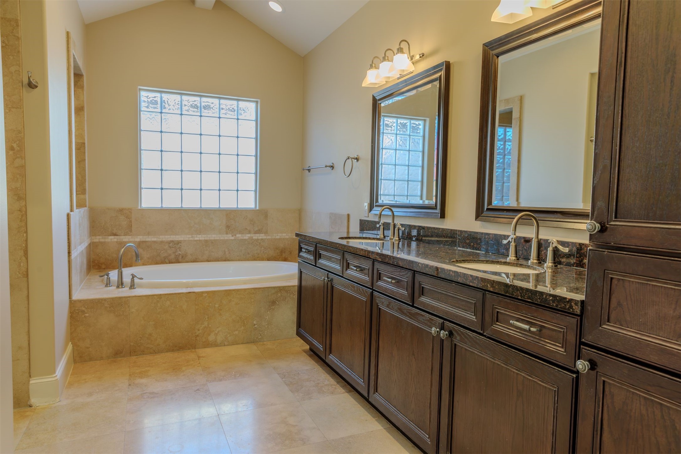 2101 Elmen Street Houston, TX 77019 - Photo 15 of 27 a bathroom with a granite countertop sink and a bathtub