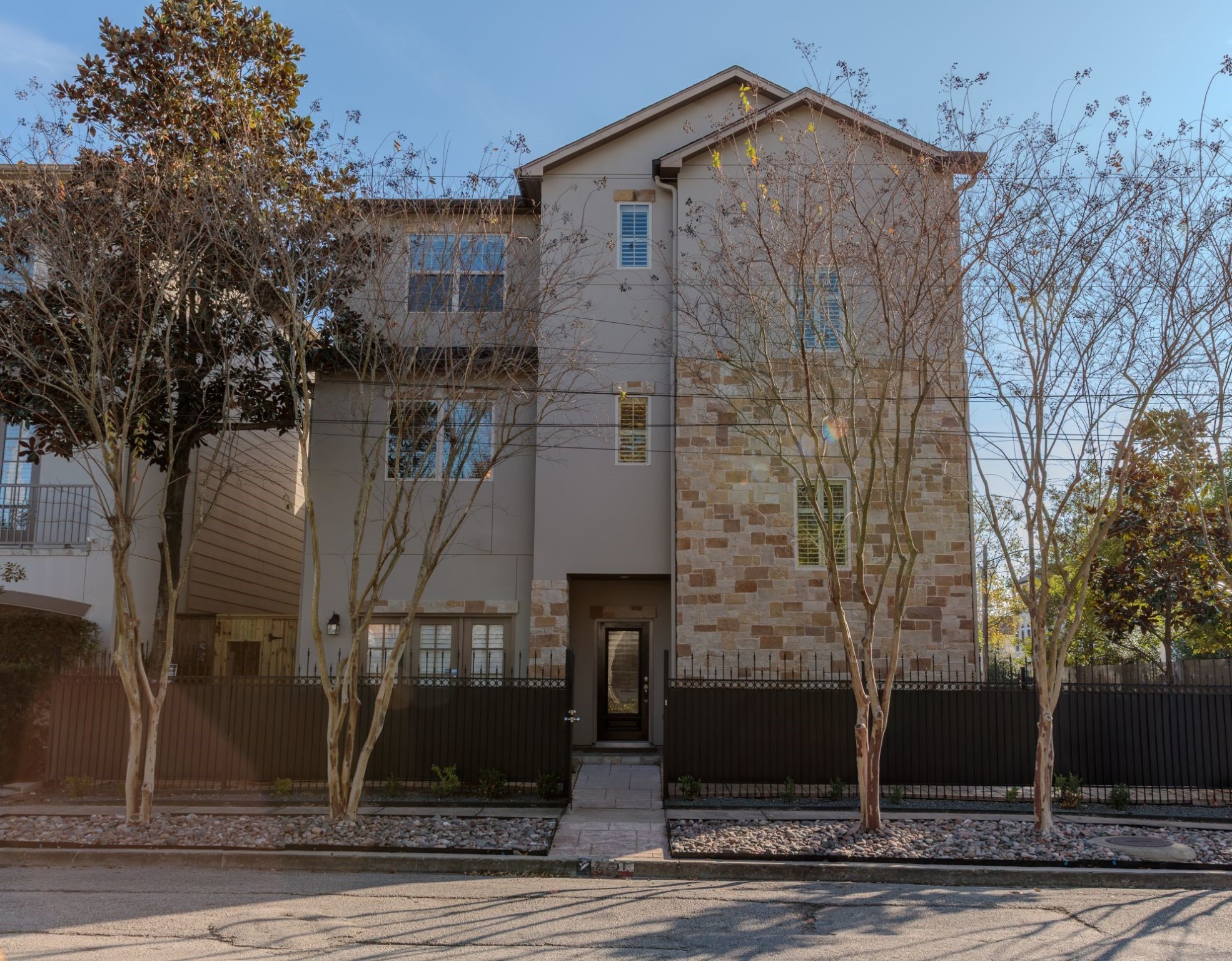 2101 Elmen Street Houston, TX 77019 - Photo 2 of 27 a view of a brick house with large windows