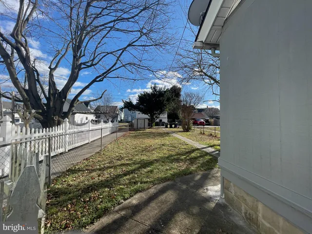 a kitchen with stainless steel appliances granite countertop a sink and a stove