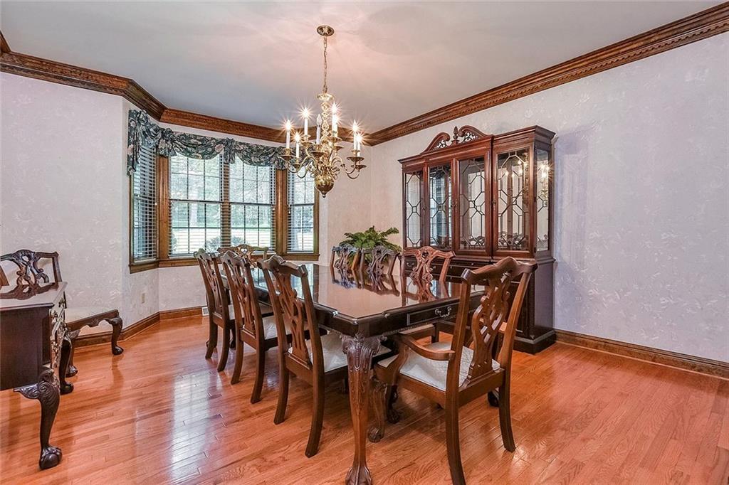 128 McCoy Place Road Sewickley, PA 15143 - Photo 14 of 25 Dining Room with Hardwood Flooring and Lovely Crown Molding