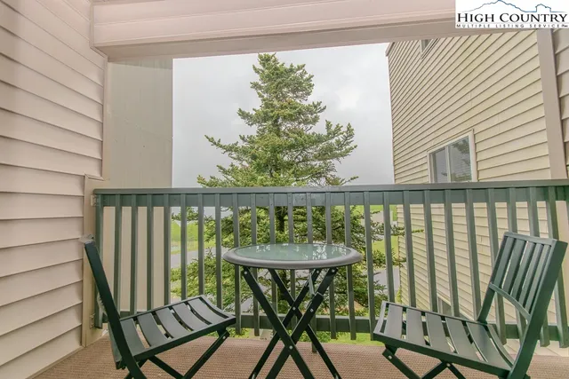 a view of a balcony with chairs
