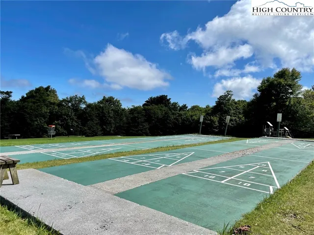a terrace with outdoor seating and city view
