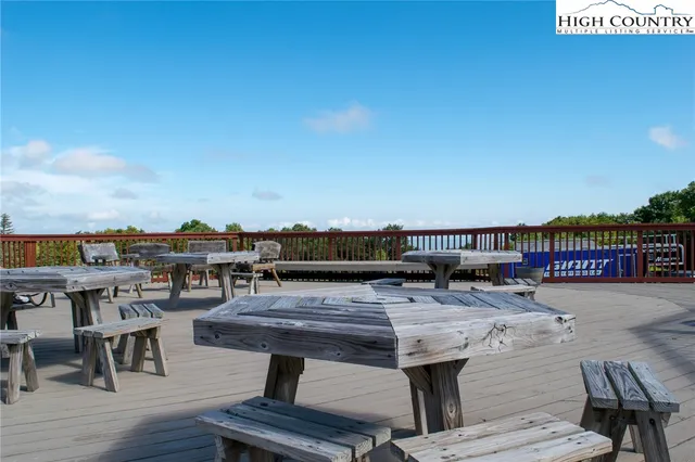 a front view of a house with a yard table and chairs