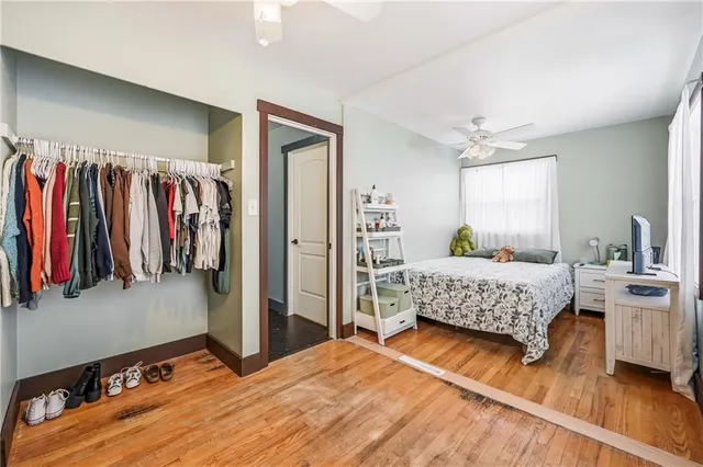 a bedroom with a bed and a walk in closet