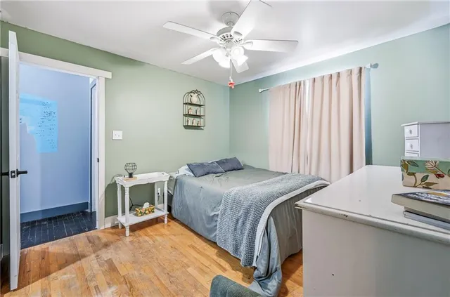 a bedroom with a bed and a table in it