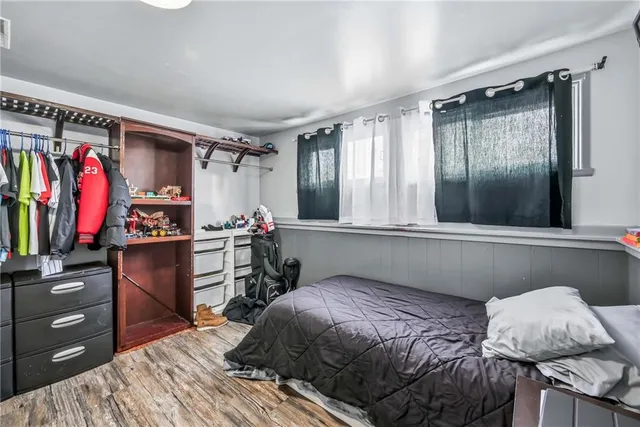 a bedroom with a bed and a walk in closet