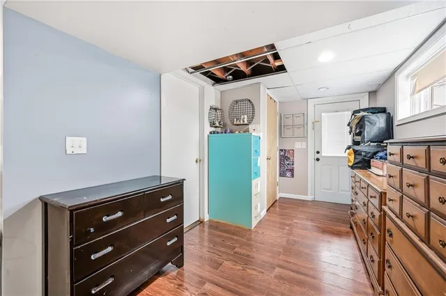 a view of room with furniture and wooden floor