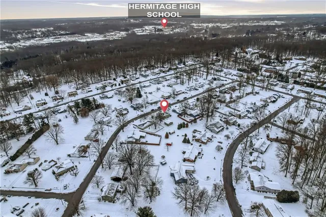 a white house with a sink and wooden floor