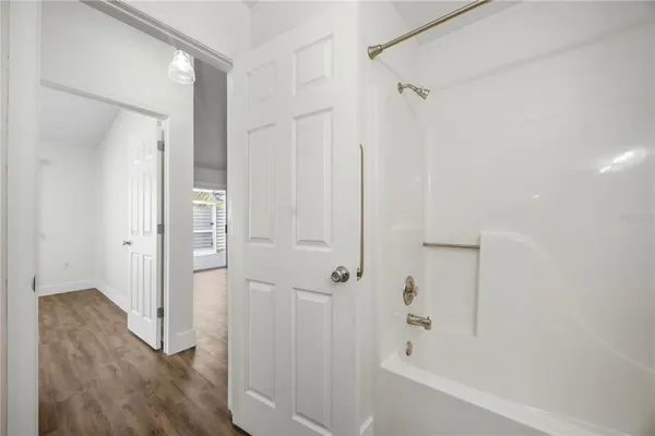 a bathroom with a bathtub and a shower